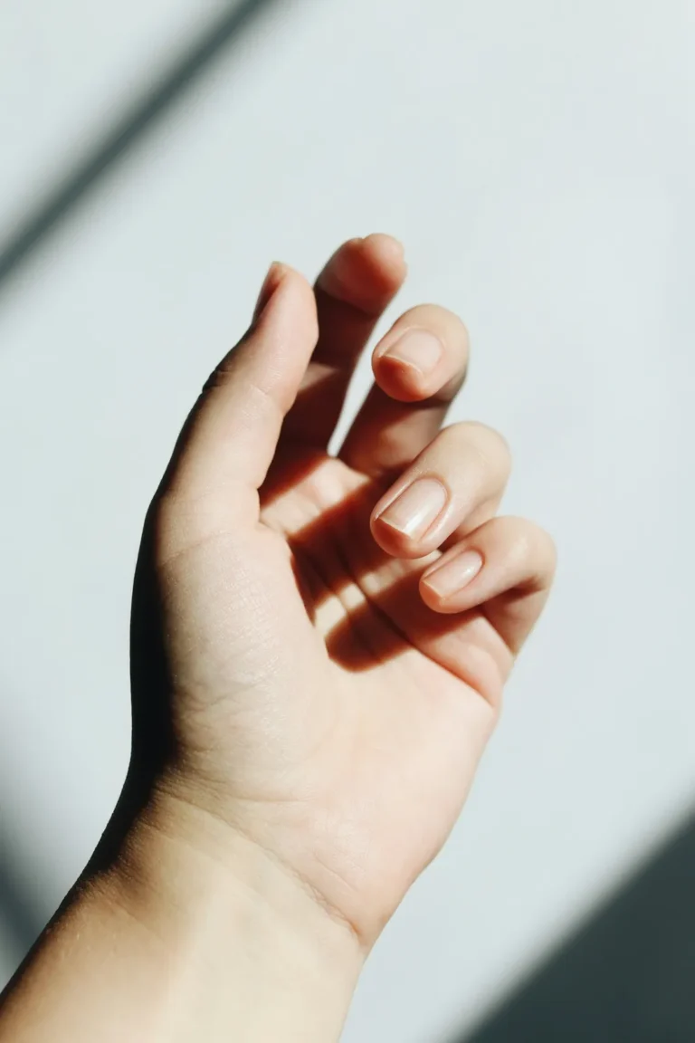 Natural French manicure in sunlight