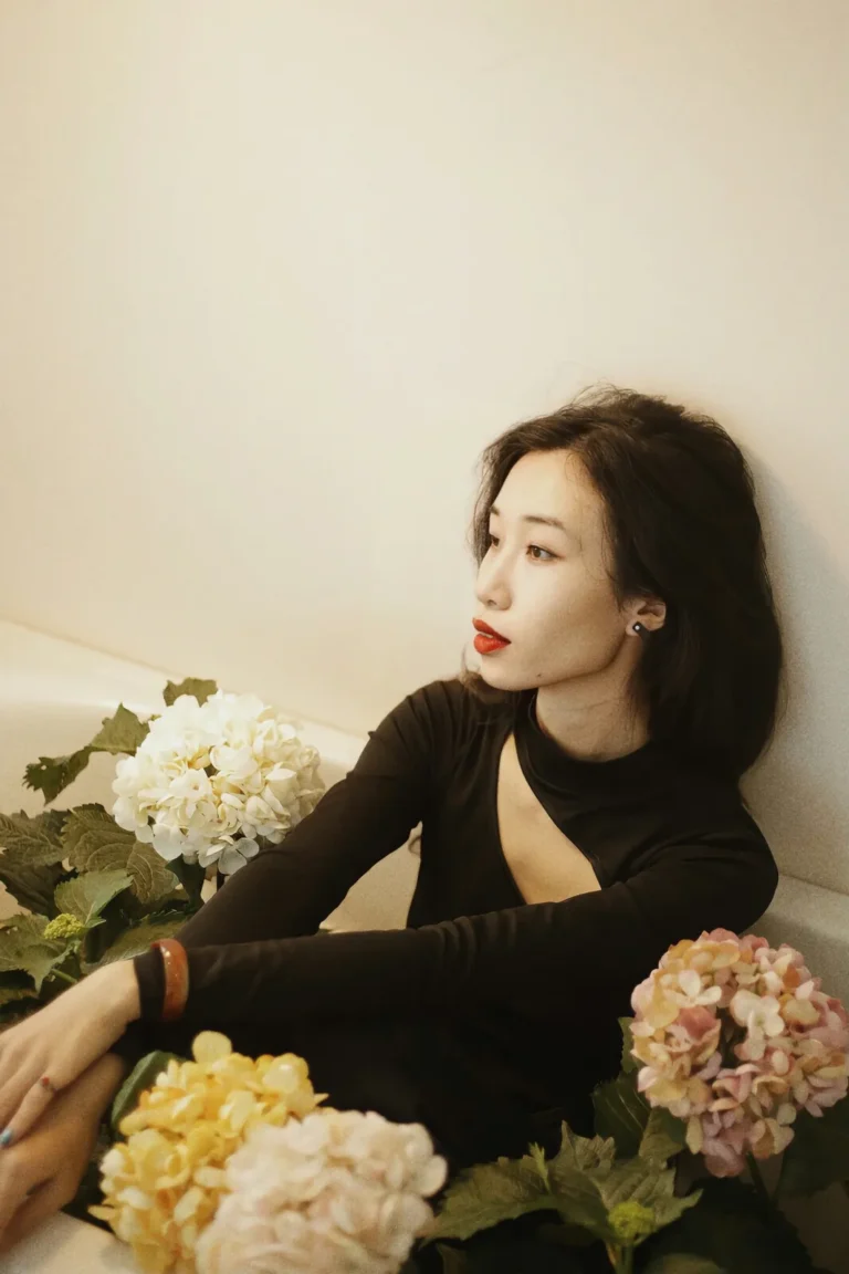 Portrait of the atelier owner with hydrangeas