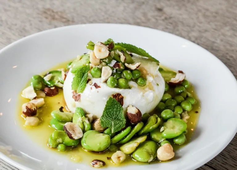 Burrata with fava beans, mint and hazelnuts