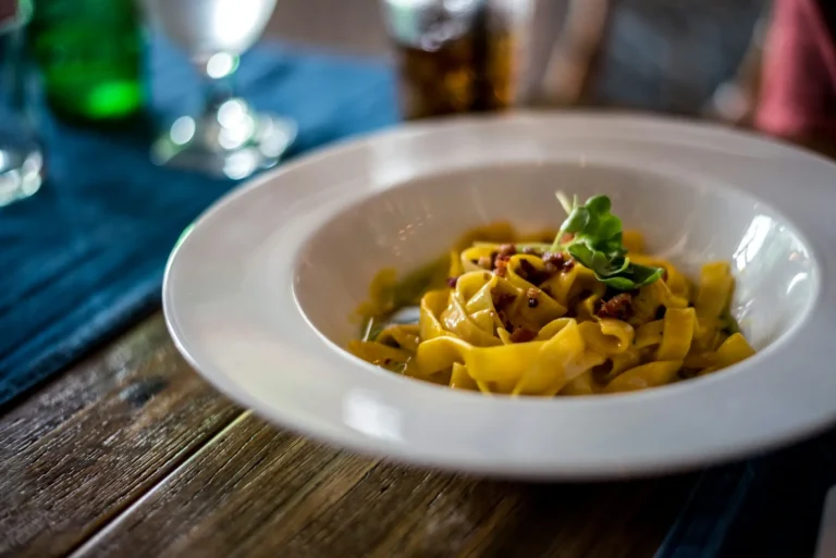 Tagliatelle in a wide white bowl