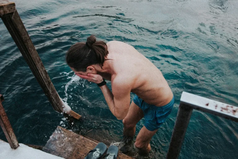 Splashing cold lake water at the ladder