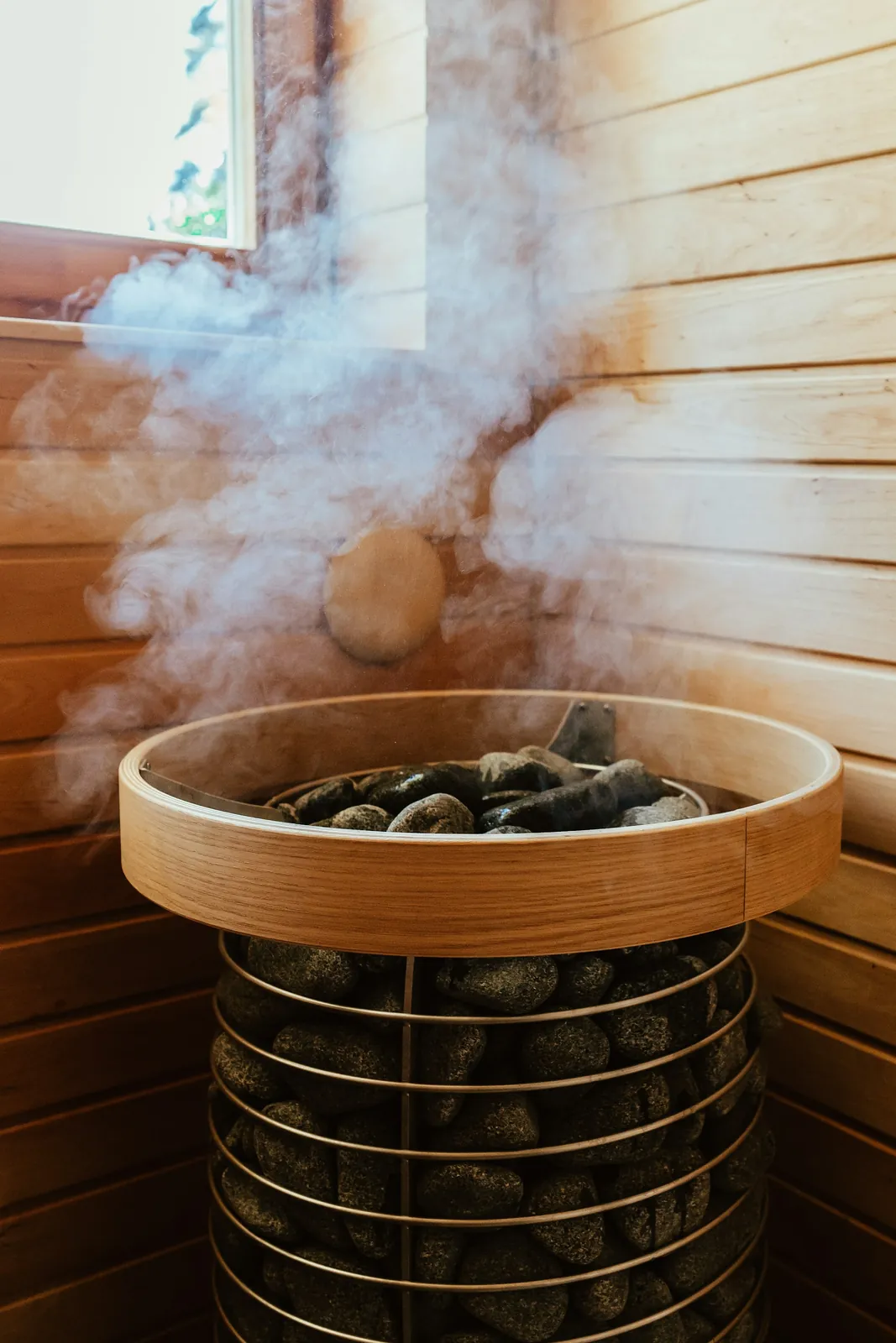 Steam rising from the sauna stones