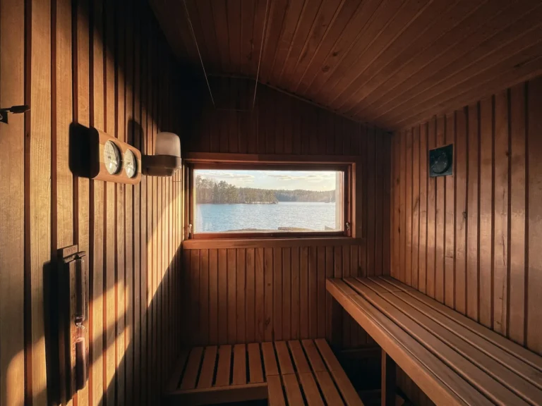 Sauna bench by a window over the lake