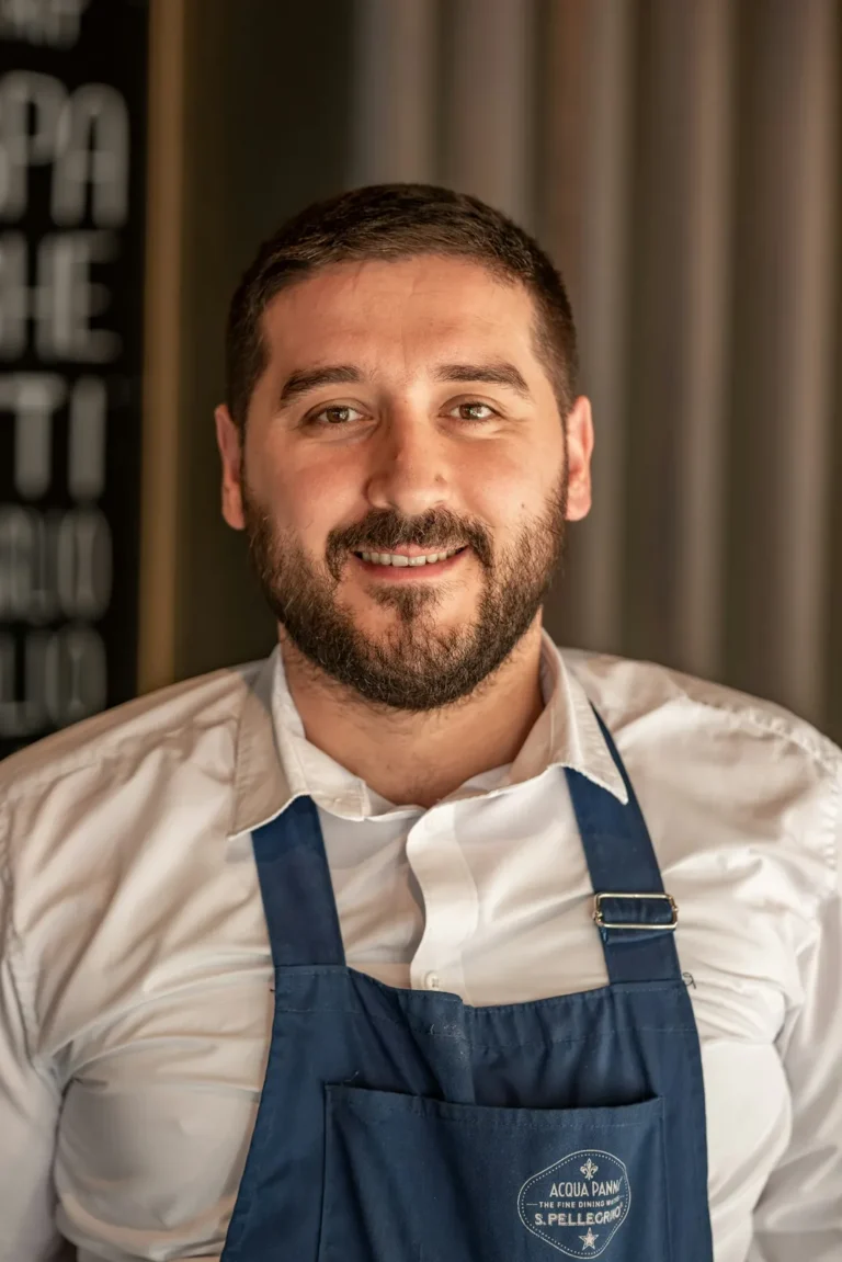 Smiling chef with a blue apron