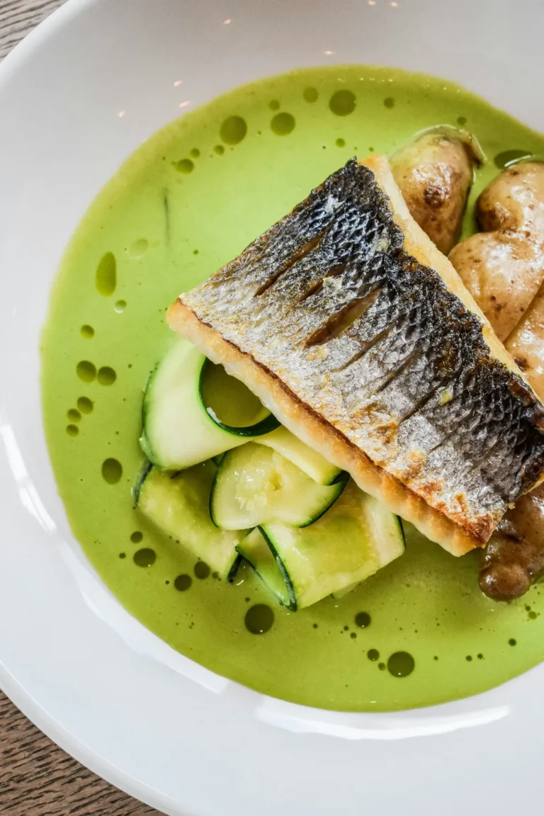 Crisp sea bass in a green herb broth
