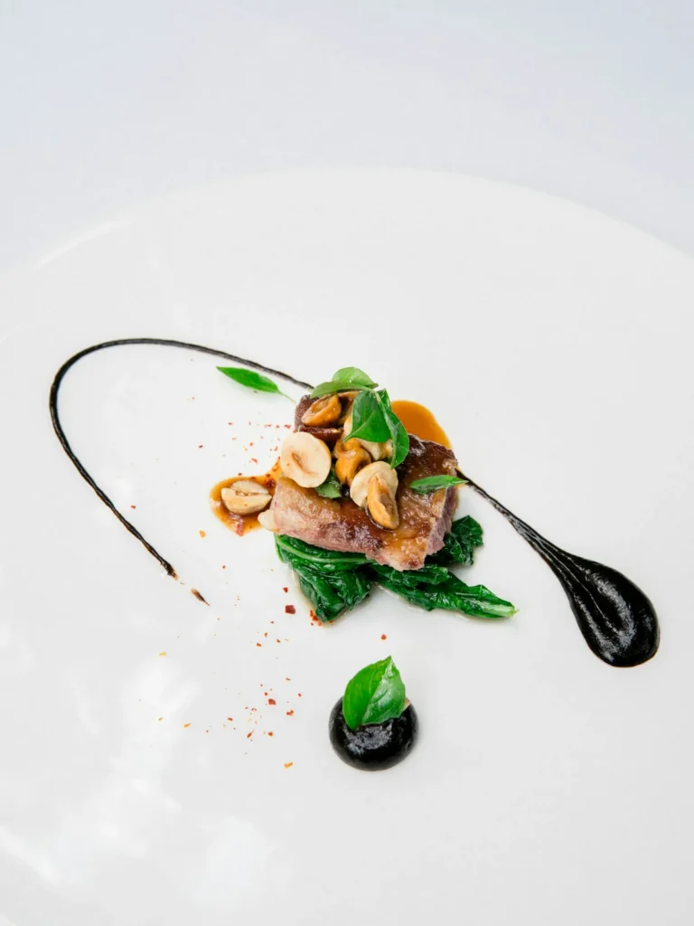 Duck with toasted hazelnuts and greens