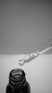 Glass pipette with a drop of serum