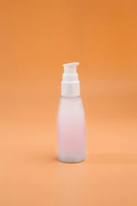 Pink pump bottle on orange