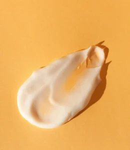 Sunscreen swatch on orange