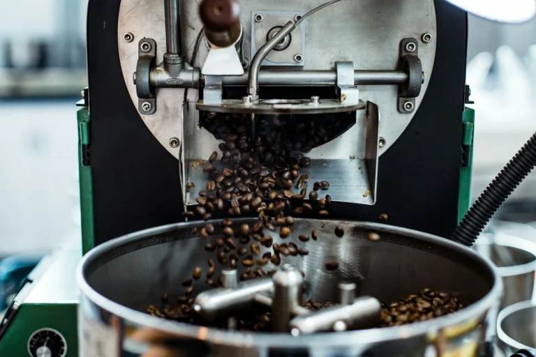 Fresh beans pouring out of the roaster