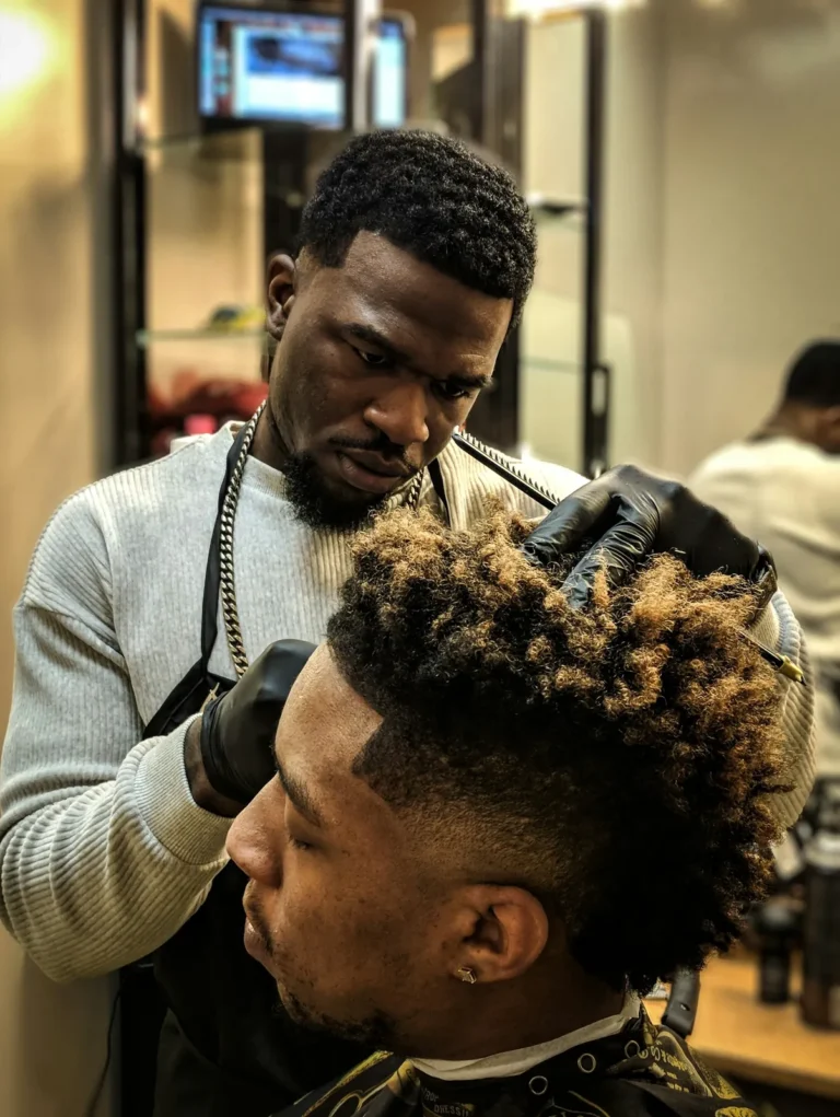Barber shaping a curly top