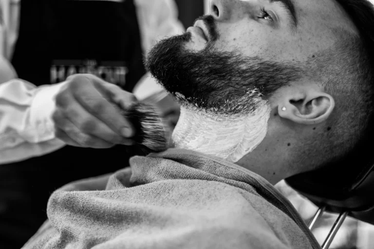 Barber lathering a beard