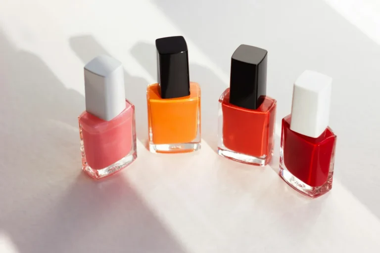 A row of red and coral polishes