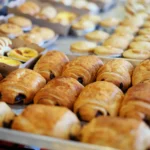 Trays of chocolate pastries and egg tarts