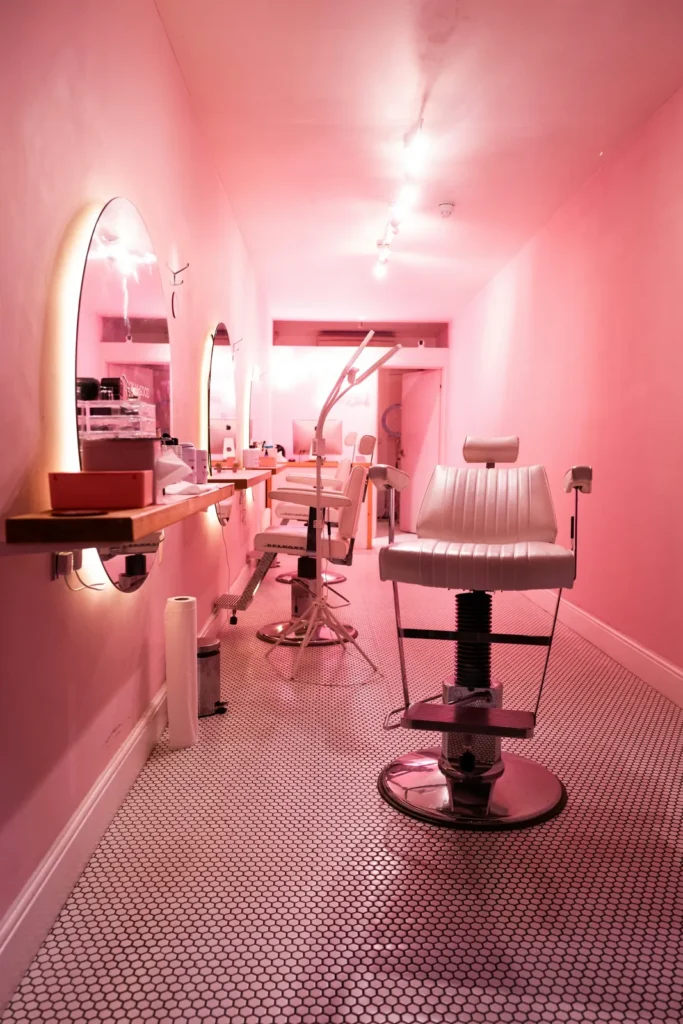 Pink lash room with a reclining chair