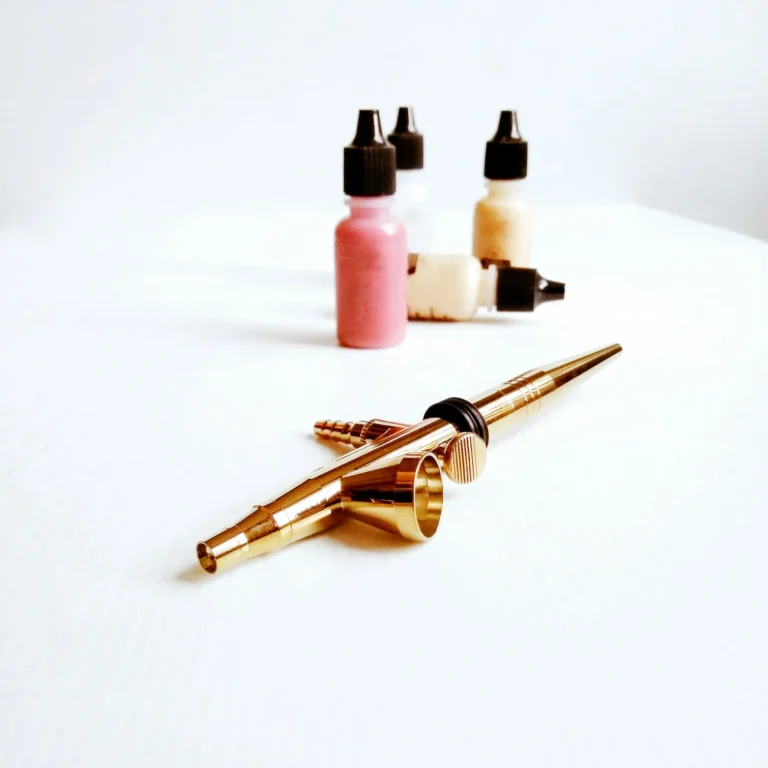 Pigment bottles and a gold pen