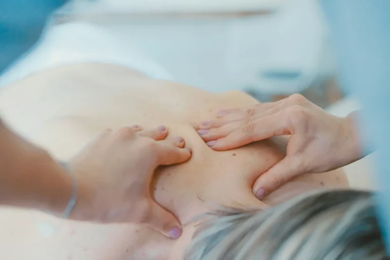 Hands working on the shoulder blade