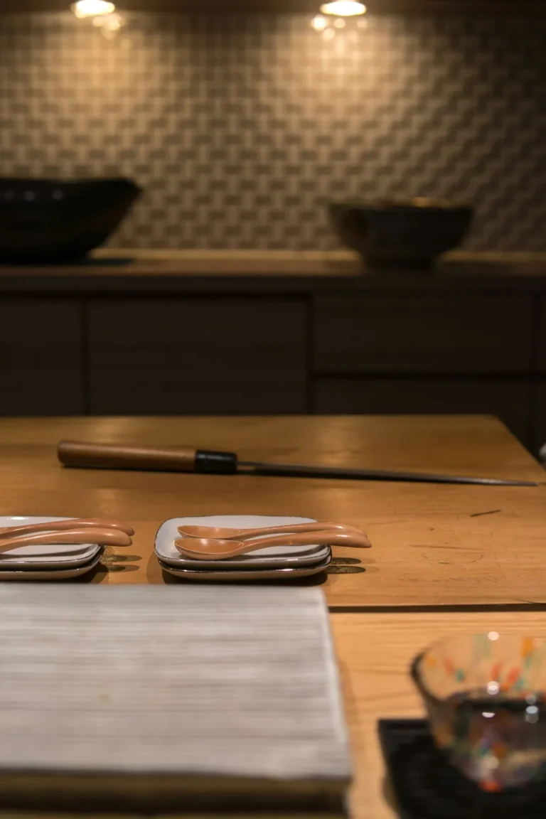 Empty hinoki counter set with a knife and plates