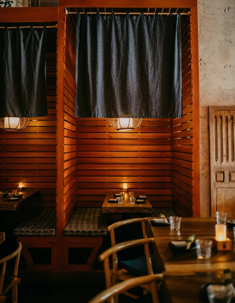 Private booth behind a noren curtain