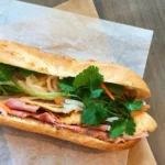 Classic banh mi with cold cuts, pickles and cilantro