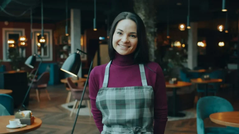 Smiling team member in an apron