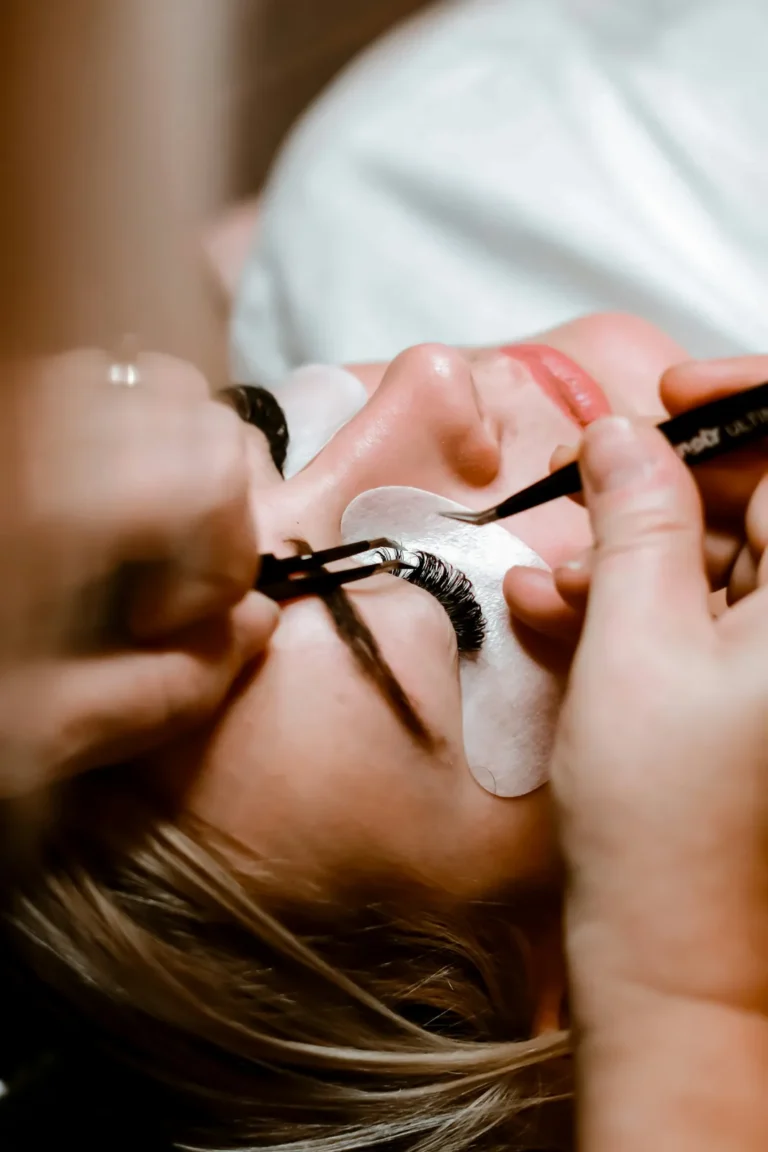 Eyelash extensions applied with fine tweezers