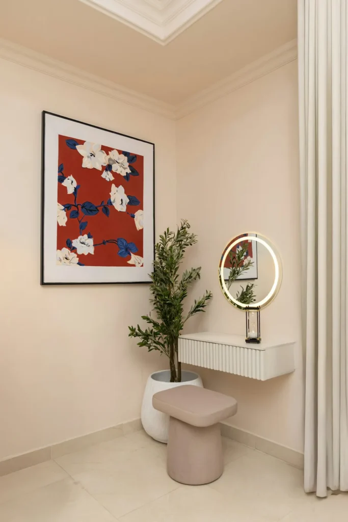 Studio corner with a round mirror and a plant