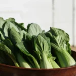 Baby bok choy in a wooden bowl