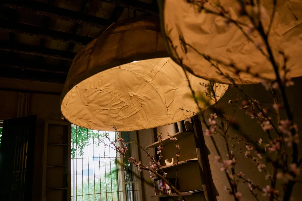 Paper lanterns by the windows of a dining room
