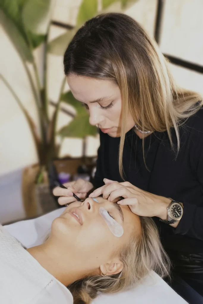 Lash artist at work in a bright studio