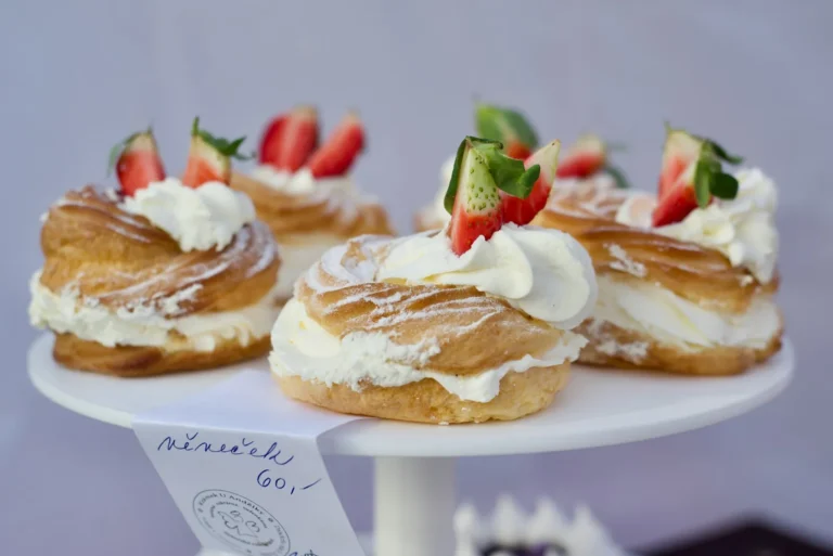 Cream puffs with strawberries on a cake stand