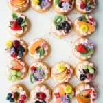 Fruit tartlets with edible flowers