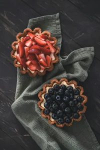 Berry tartlets on a linen cloth