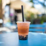 Thai tea with pearls on a sunny table