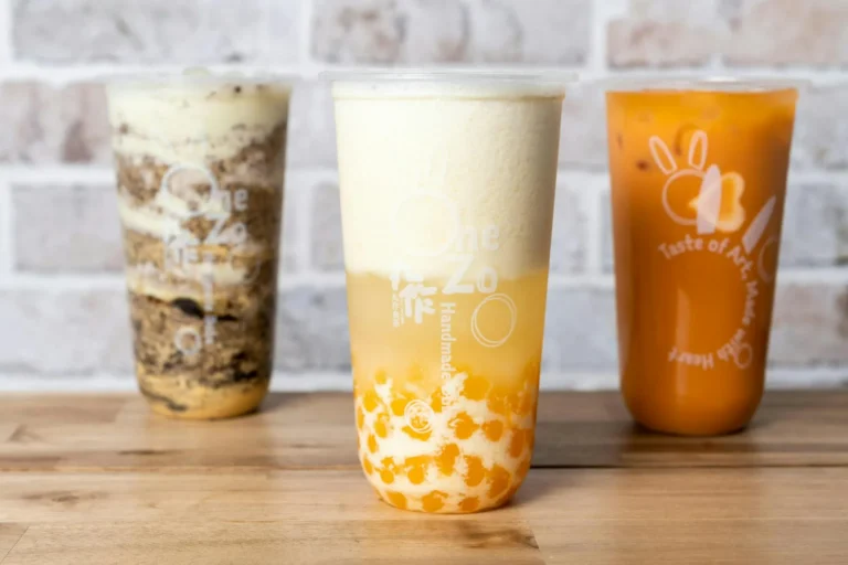 Three bubble teas on a wooden counter