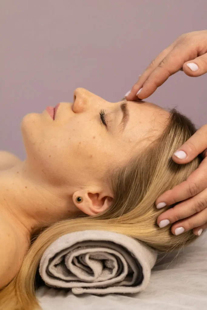 Temple massage on a rolled towel