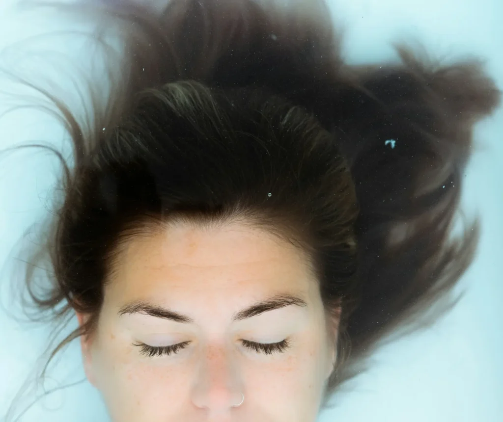Woman floating with her hair spread around her