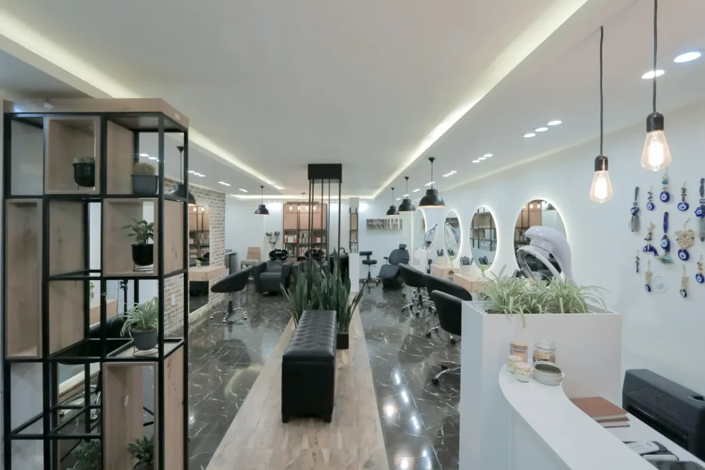Long white salon with round mirrors