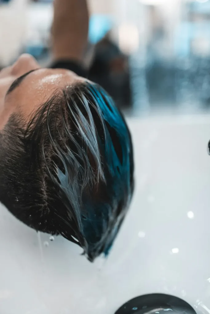 Dark hair under running water
