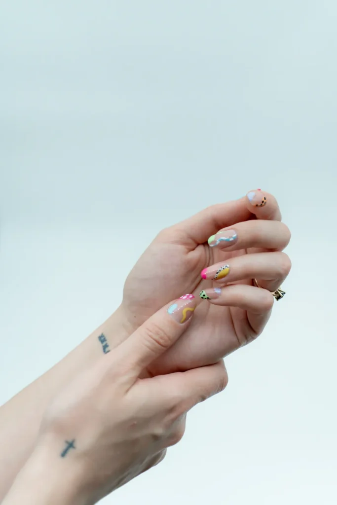 Nail art priced by tier, with photo examples for each level