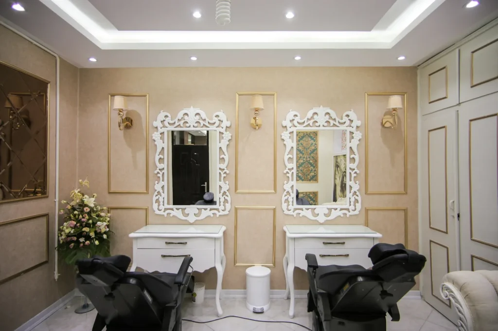 Carved white mirrors and quiet stations