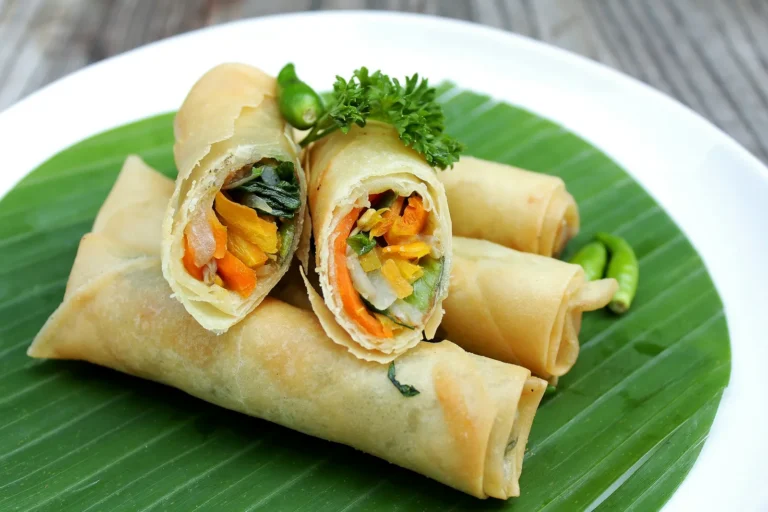Crispy spring rolls on a banana leaf