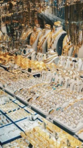 A glass case full of gold jewelry