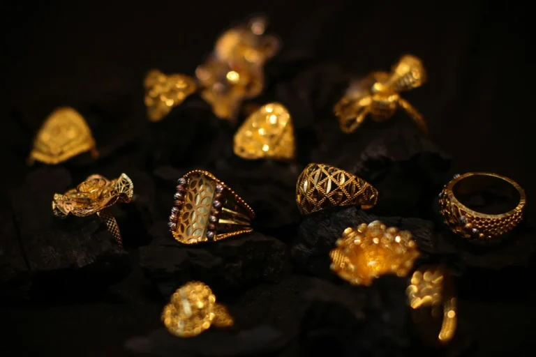 Gold rings on dark stone