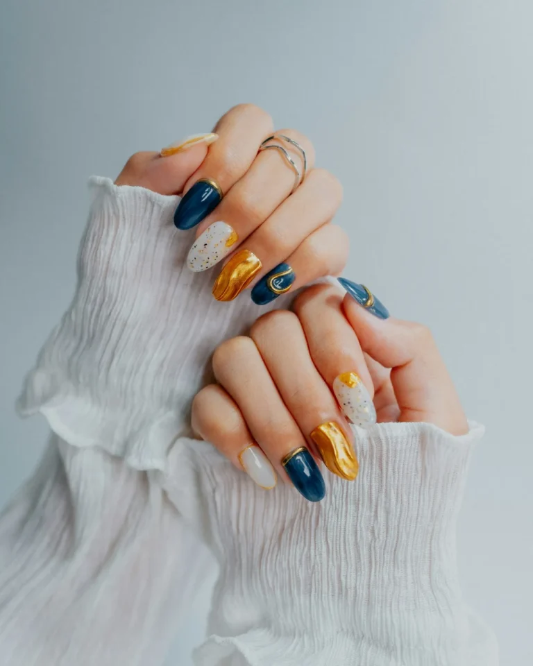 Navy, white and gold foil nails