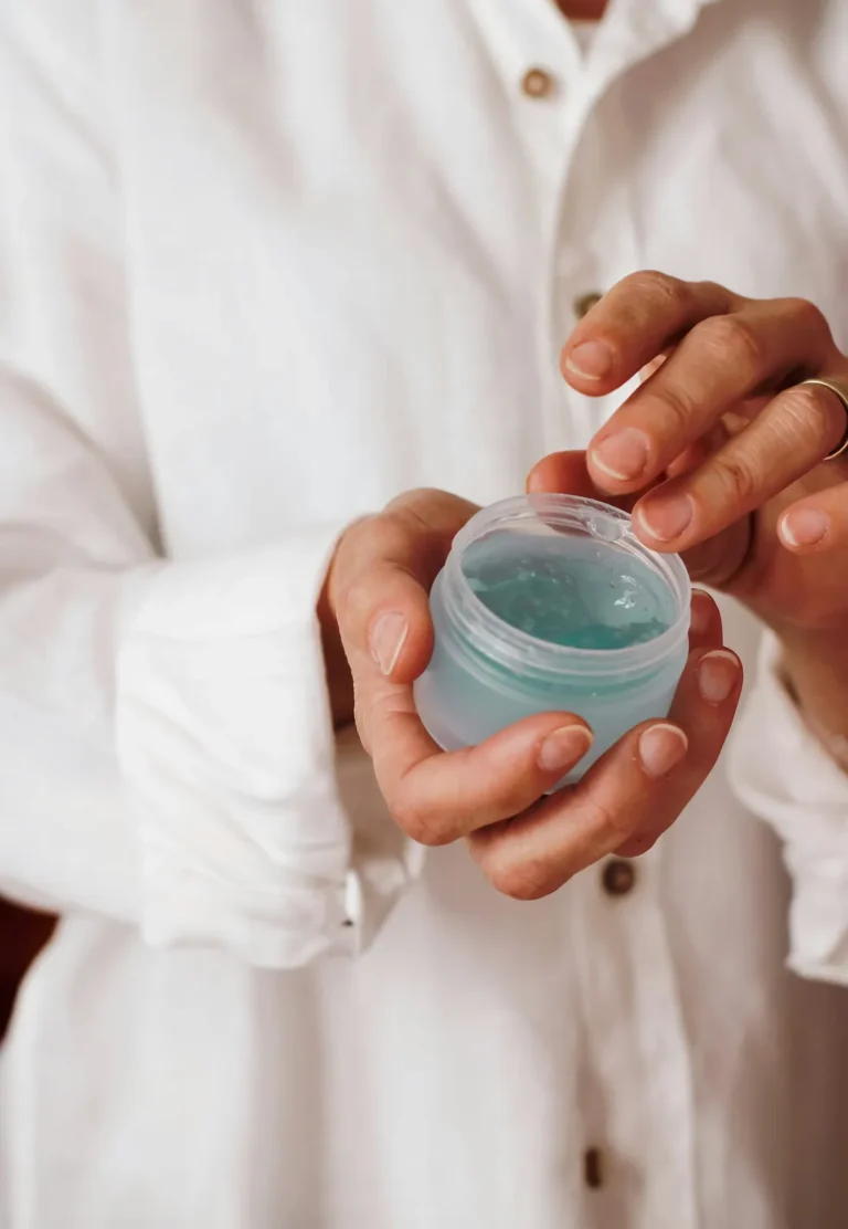 Hands holding a cooling gel mask