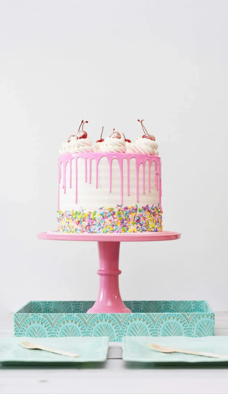 Pink drip cake with sprinkles