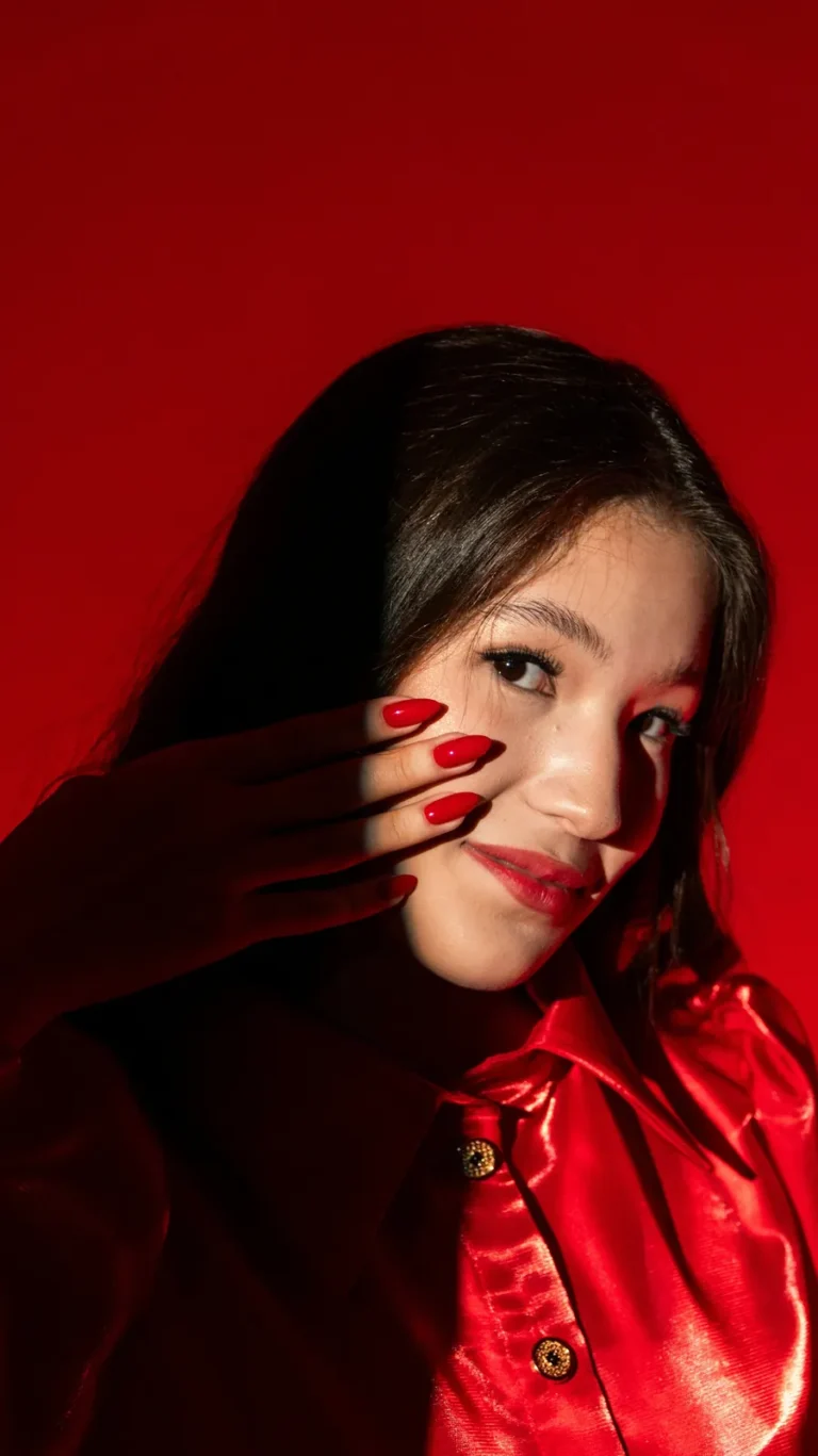 Woman in red with red nails