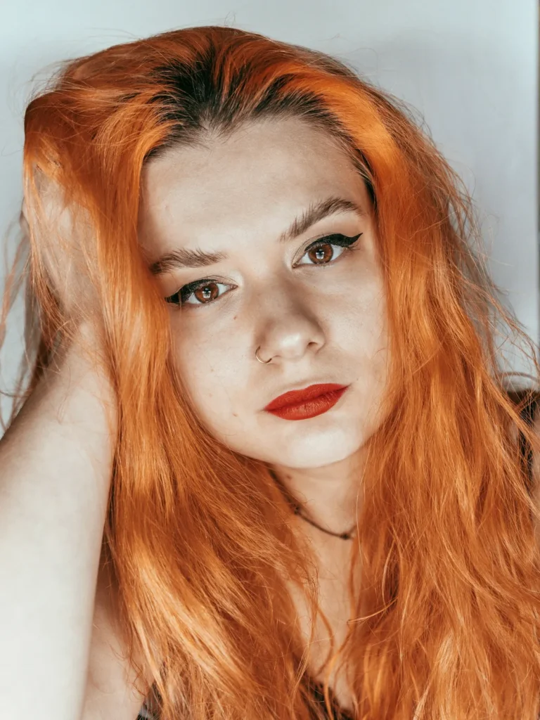 Portrait of a woman with long orange hair