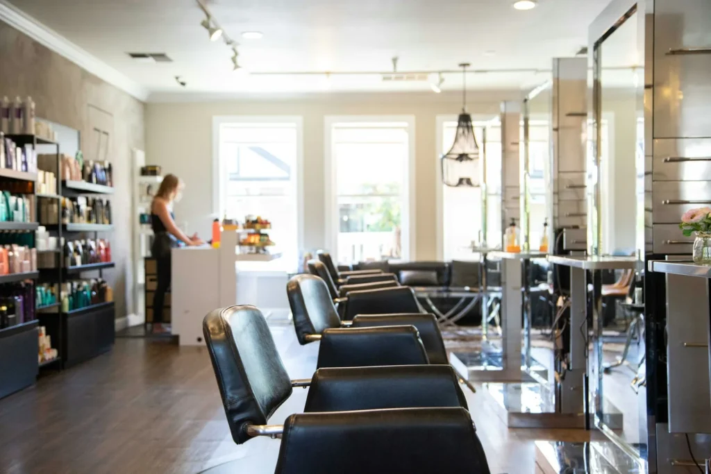 Row of salon chairs by the windows